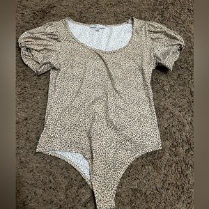 Never worn cheetah body suit size M